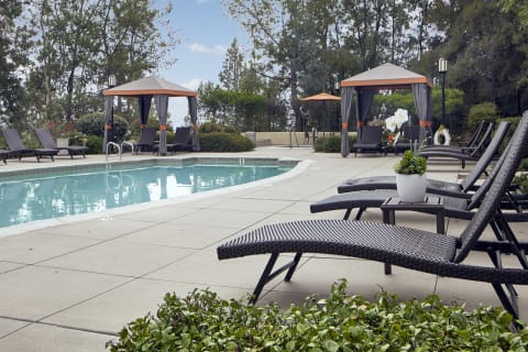 Outdoor pool area with lounge chairs